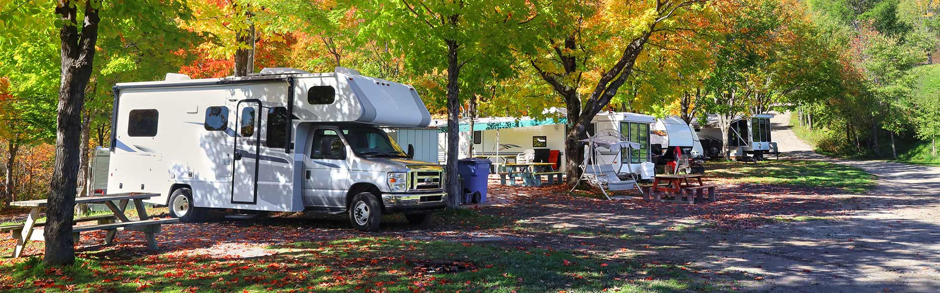 RV and Camping Trailers in Camping Site at Fall